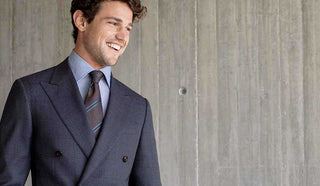 Picture of man wearing a navy blue Canali suit