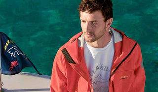 Image of man on a boat wearing a Paul & Shark jacket