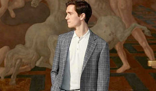 Image of man wearing a Canali jacket with a painting as background