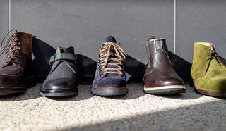 Picture of Winter boots lined up against a grey wall