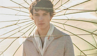 Image of man wearing a LBM1911 jacket with an open parachute as background