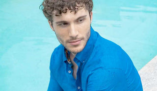 Image of man wearing Paul & Shark by the pool