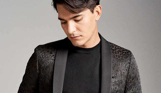 Picture of man wearing a jacket and pant combo from Sand