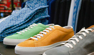 Image of three different colour sneakers lined up right next to eatch otehr
